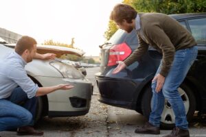 Ashland Car Accident Lawyer - Two people quarrelling after a hitting their car
