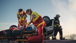 Covington Catastrophic Injury Lawyer - Troopers Providing first aid to accident victims.