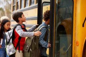 kids-getting-on-a–bus