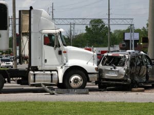 Big White Semi Truck Hits Small Car