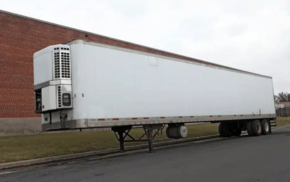 White reefer trailer truck.