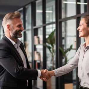 Two car accident lawyers shaking hands