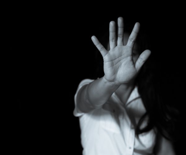 A person looking thoughtful, symbolizing support for victims.