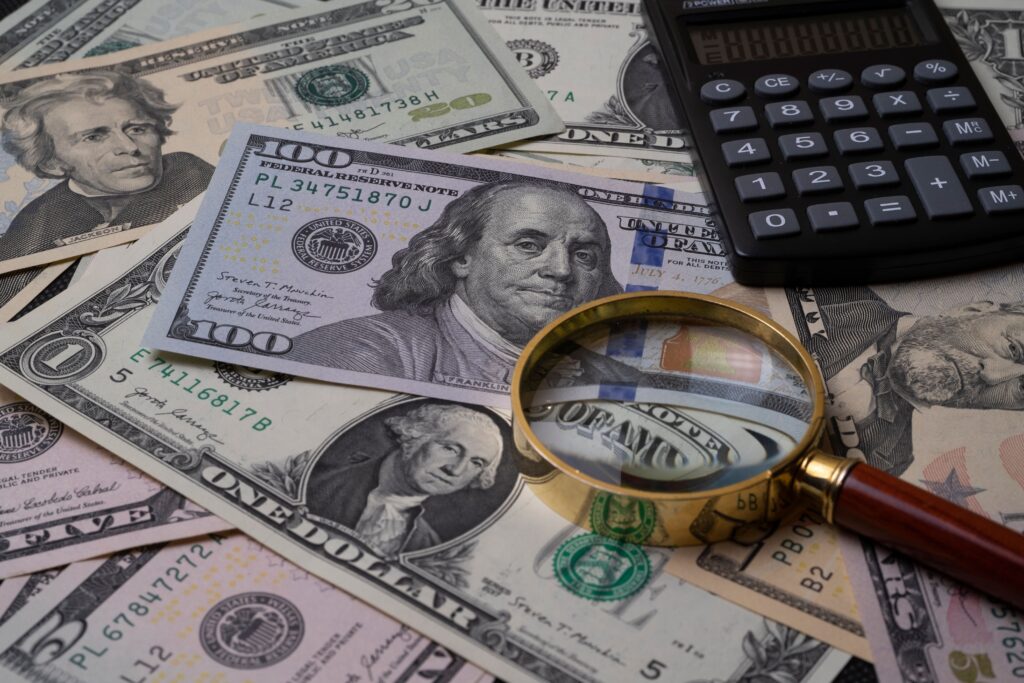 Cash and financial documents representing compensation, settlements, and contingency fee arrangements