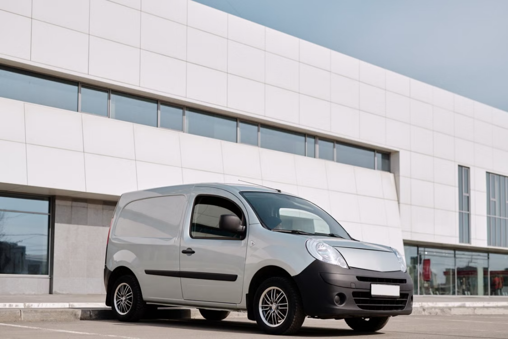 A van parked beside a commercial building